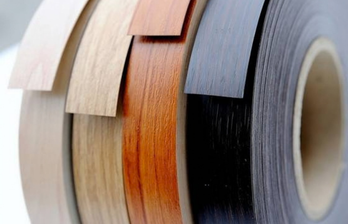 Rolls of edge banding in different colours and woodgrain finishes