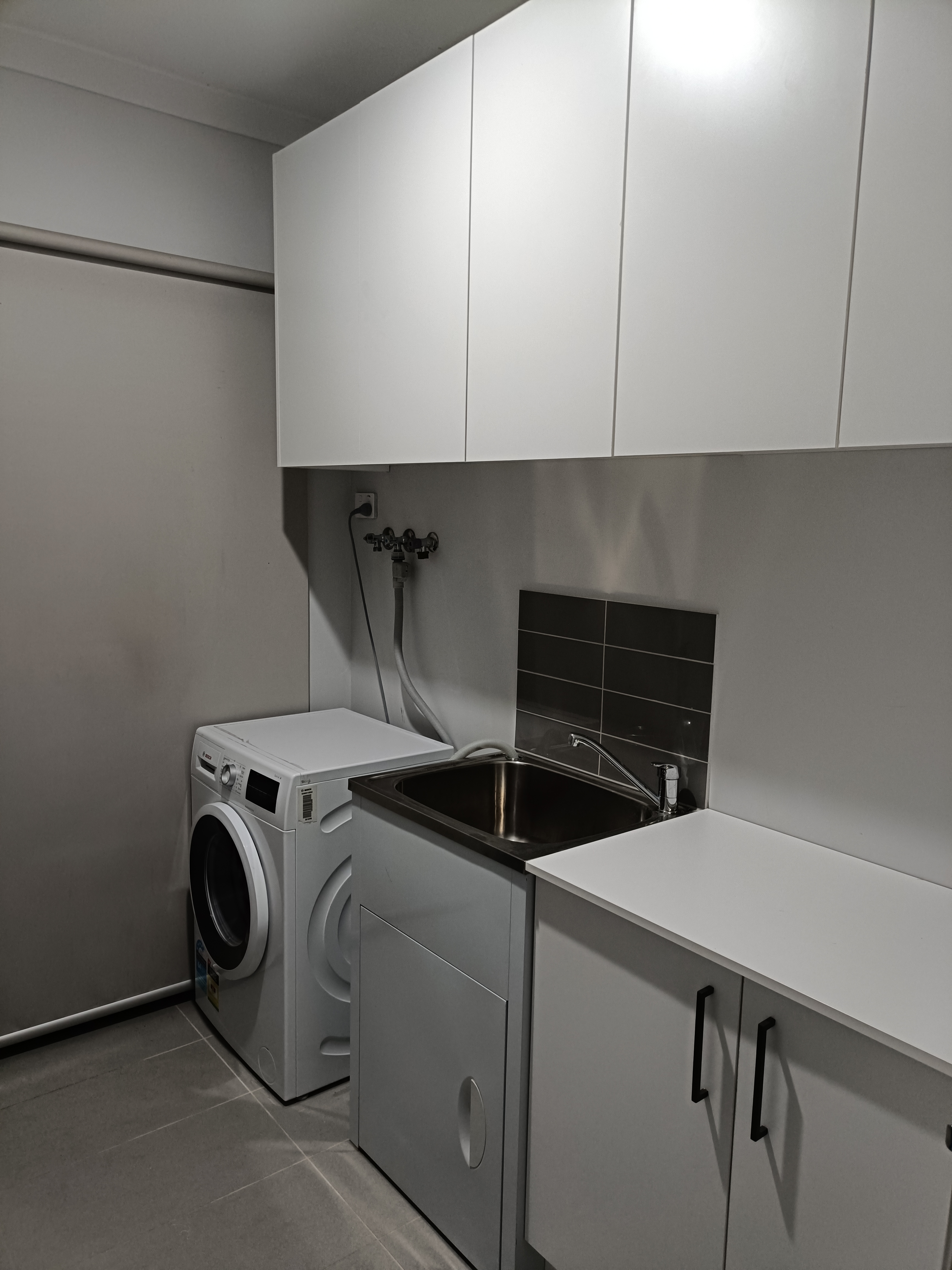 Completed under-bench laundry cabinets in Kalkallo